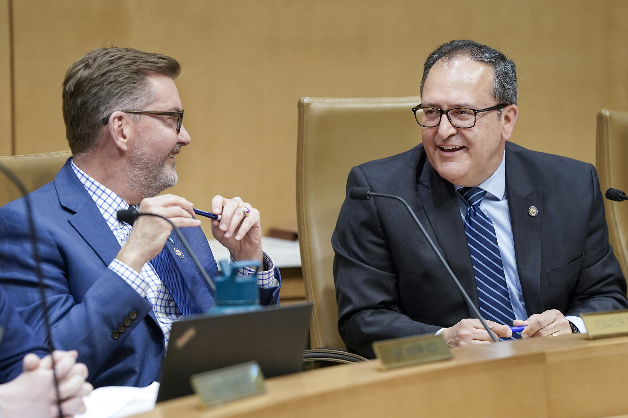 Sen. D. Scott Dibble and Rep. Jon Koznick chat before the start of the transportation conference committee May 8. (Photo by Michele Jokinen)